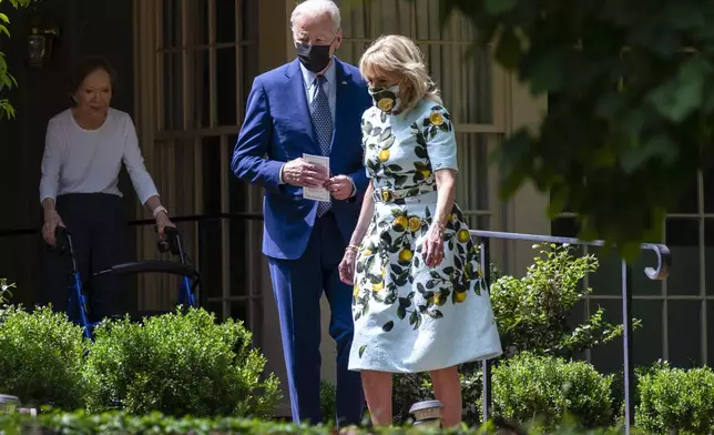 FILE - Former first lady Rosalynn Carter looks on as President Joe Biden and first lady Jill Biden leave the home of former President Jimmy Carter during a trip to mark Biden's 100th day in office, Thursday, April 29, 2021, in Plains, Ga. (AP Photo/Evan Vucci, File)