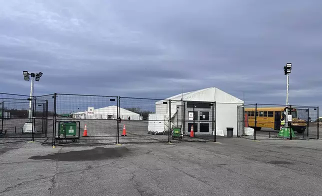 FILE - The gate at the migrant shelter, is closed at Floyd Bennett Field on Wednesday, Dec. 4, 2024 in New York. (AP Photo/Philip Marcelo, File)