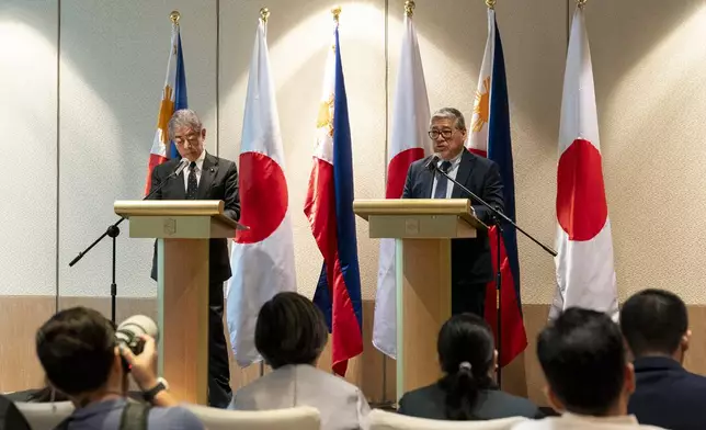Japanese Foreign Minister Takeshi Iwaya, left, and Philippine Foreign Secretary Enrique Manalo attend a joint press conference in Taguig City, Philippines Wednesday, Jan. 15, 2025. (Lisa Marie David/Pool Photo via AP)