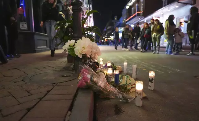 A memorial on Bourbon Street sits at the site of a deadly truck attack on New Year's Day in New Orleans, Friday, Jan. 3, 2025. (AP Photo/Gerald Herbert)