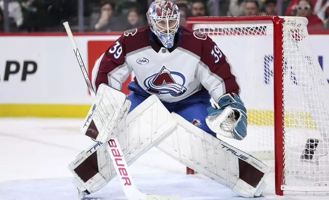 Colorado Avalanche goaltender Mackenzie Blackwood defends his net during the second period of an NHL hockey game against the Minnesota Wild, Thursday, Jan. 9, 2025, in St. Paul, Minn. (AP Photo/Matt Krohn)