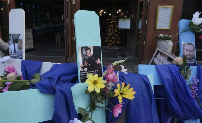 A memorial to the victims of a deadly truck attack is seen on Canal Street in the French Quarter, Friday, Jan. 3, 2025, in New Orleans. (AP Photo/George Walker IV)