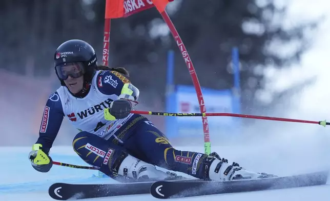 Sweden's Sara Hector speeds down the course during an alpine ski, women's World Cup giant slalom race in Kranjska Gora, Slovenia, Saturday, Jan. 4, 2025. (AP Photo/Giovanni Auletta)