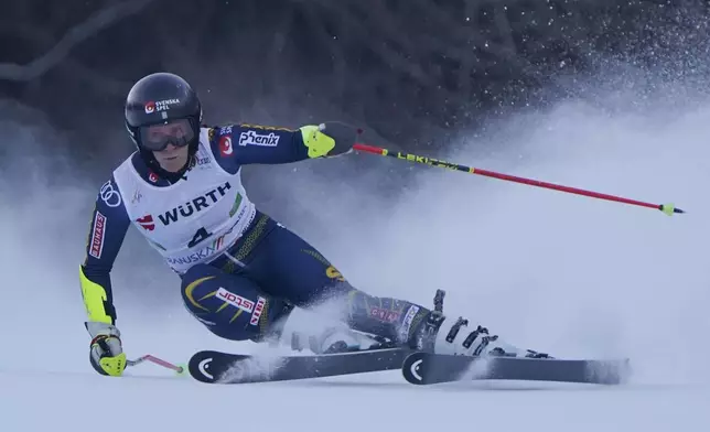 Sweden's Sara Hector speeds down the course during an alpine ski, women's World Cup giant slalom race, in Kranjska Gora, Slovenia, Saturday, Jan. 4, 2025. (AP Photo/Piermarco Tacca)