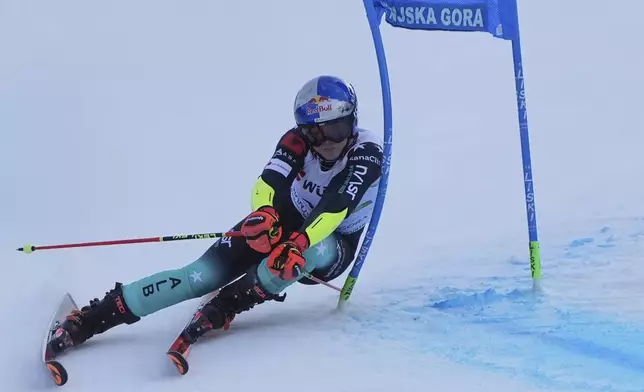 Albania's Lara Colturi speeds down the course during an alpine ski, women's World Cup giant slalom race in Kranjska Gora, Slovenia, Saturday, Jan. 4, 2025. (AP Photo/Giovanni Auletta)