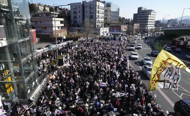 Supporters of impeached South Korean President Yoon Suk Yeol stage a rally to oppose a court having issued a warrant to detain Yoon, near the presidential residence in Seoul, South Korea, Thursday, Jan. 2, 2025. (AP Photo/Ahn Young-joon)