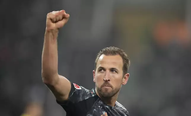 Bayern's Harry Kane celebrates after scoring the opening goal during the German Bundesliga soccer match between Borussia Moenchengladbach and Bayern Munich in Moenchengladbach, Germany, Saturday, Jan. 11, 2025. (AP Photo/Martin Meissner)