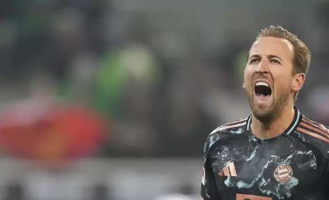 Bayern's Harry Kane celebrates after scoring the opening goal during the German Bundesliga soccer match between Borussia Moenchengladbach and Bayern Munich in Moenchengladbach, Germany, Saturday, Jan. 11, 2025. (AP Photo/Martin Meissner)