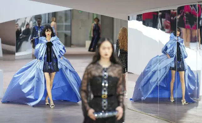 A model wears a creation as part of the Chanel Haute Couture Spring Summer 2025 collection, that was presented in Paris, Tuesday, Jan. 28, 2025. (AP Photo/Lewis Joly)