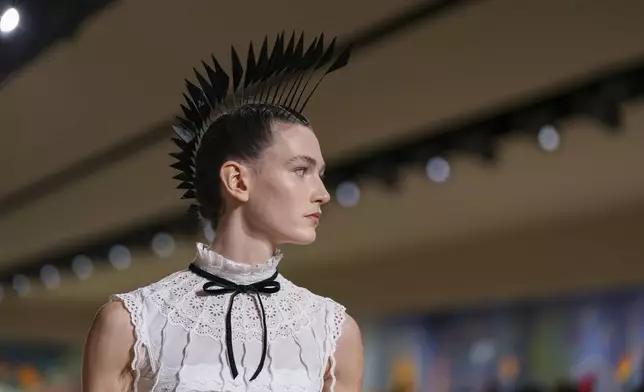 A model wears a creation as part of the Christian Dior Haute Couture Spring Summer 2025 collection, that was presented in Paris, Monday, Jan. 27, 2025. (AP Photo/Lewis Joly).