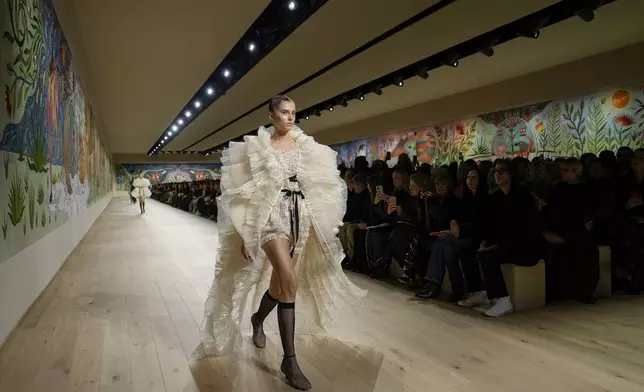 A model wears a creation as part of the Christian Dior Haute Couture Spring Summer 2025 collection, that was presented in Paris, Monday, Jan. 27, 2025. (AP Photo/Lewis Joly).
