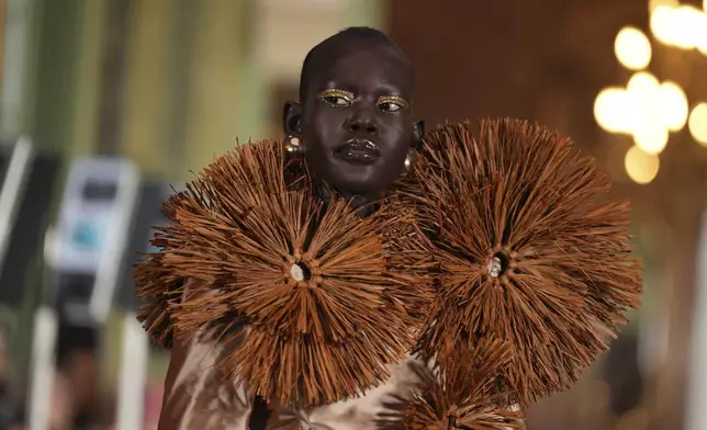 A model wears a creation as part of the Imane Ayissi Haute Couture Spring Summer 2025 collection, that was presented in Paris, Monday, Jan. 27, 2025. (AP Photo/Lewis Joly)