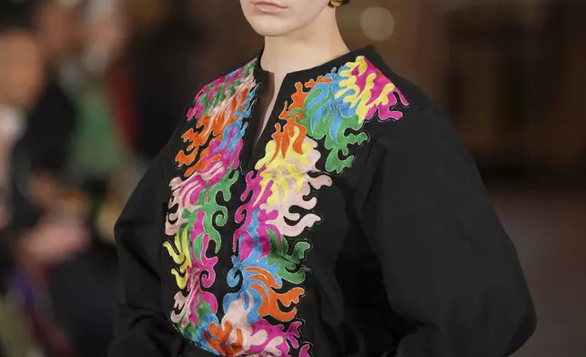 A model wears a creation as part of the Imane Ayissi Haute Couture Spring Summer 2025 collection, that was presented in Paris, Monday, Jan. 27, 2025. (AP Photo/Lewis Joly)