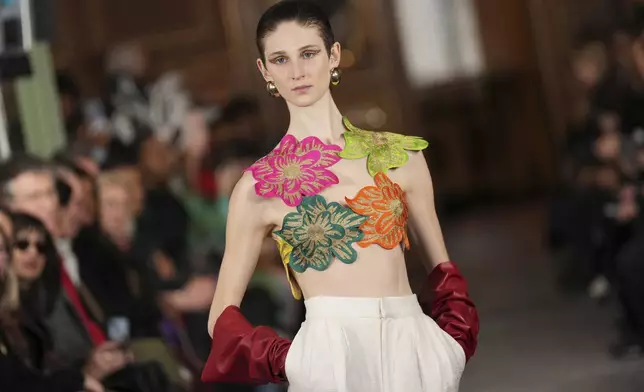 A model wears a creation as part of the Imane Ayissi Haute Couture Spring Summer 2025 collection, that was presented in Paris, Monday, Jan. 27, 2025. (AP Photo/Lewis Joly)