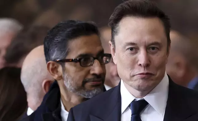 Elon Musk, right, and Google CEO Sundar Pichai arrive before the 60th Presidential Inauguration in the Rotunda of the U.S. Capitol in Washington, Monday, Jan. 20, 2025. (Kevin Lamarque/Pool Photo via AP)