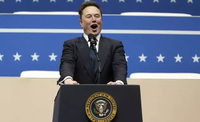 Elon Musk speaks at an indoor Presidential Inauguration parade event in Washington, Monday, Jan. 20, 2025. (AP Photo/Matt Rourke)
