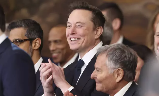 Elon Musk listens as President Donald Trump speaks after taking the oath of office at the 60th Presidential Inauguration in the Rotunda of the U.S. Capitol in Washington, Monday, Jan. 20, 2025. (Kevin Lamarque/Pool Photo via AP)