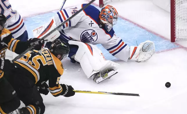 Edmonton Oilers goaltender Stuart Skinner (74) stretches after making a save against Boston Bruins right wing Justin Brazeau (55) during the third period of an NHL hockey game, Tuesday, Jan. 7, 2025, in Boston. (AP Photo/Charles Krupa)