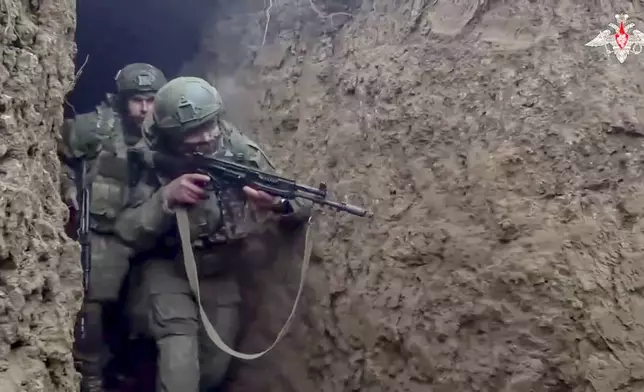 In this photo taken from video distributed by Russian Defense Ministry Press Service on Saturday, Jan. 4, 2025, Russian servicemen attend a combat training for assault units in an undisclosed location. (Russian Defense Ministry Press Service via AP)