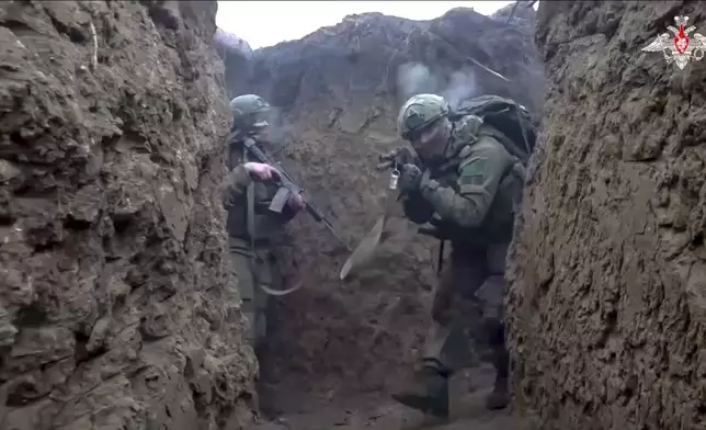 In this photo taken from video distributed by Russian Defense Ministry Press Service on Saturday, Jan. 4, 2025, Russian servicemen attend a combat training for assault units in an undisclosed location. (Russian Defense Ministry Press Service via AP)