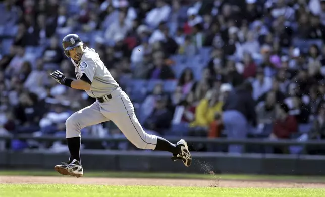 FILE - Seattle Mariners' Ichiro Suzuki glances toward home plate as he steals second base during the seventh inning of a baseball game against the Chicago White Sox Sunday, Sept. 24, 2006, in Chicago. (AP Photo/Jeff Roberson, File)