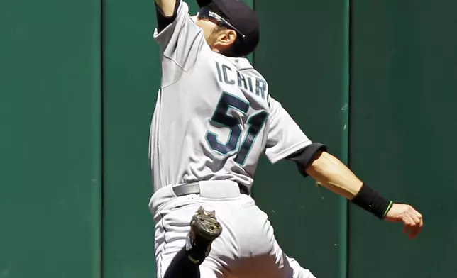 FILE - Seattle Mariners right fielder Ichiro Suzuki, of Japan, makes a leaping catch at the wall to rob Cleveland Indians' Carlos Santana of a hit in the fourth inning of a baseball game Thursday, May 17, 2012, in Cleveland. (AP Photo/Mark Duncan, File)