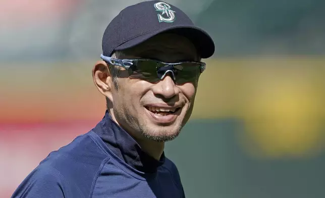 FILE - Former Seattle Mariners outfielder Ichiro Suzuki smiles as he visits with players and coaches before batting practice before the team's baseball game against the Los Angeles Angels, Thursday, June 16, 2022, in Seattle. (AP Photo/Ted S. Warren, File)