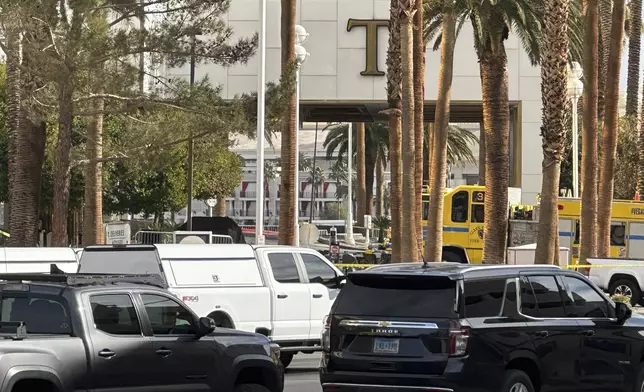 Police block the area after a vehicle caught fire and exploded outside the lobby of President-elect Donald Trump's hotel Wednesday, Jan. 1, 2025. (AP Photo/Ty ONeil)