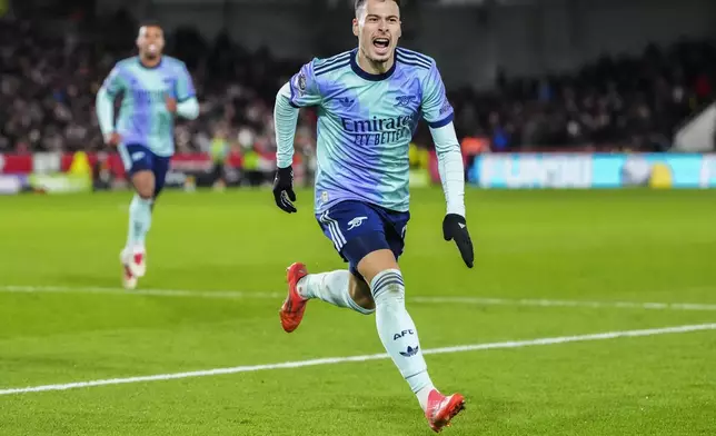 Arsenal's Gabriel Martinelli celebrates after scoring his side third goal during the English Premier League soccer match between Brentford and Arsenal at the Gtech Community stadium in London, Wednesday, Jan. 1, 2025. (AP Photo/Kirsty Wigglesworth)