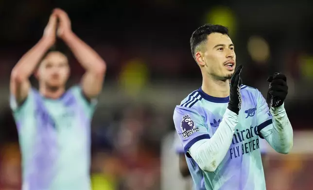 Arsenal's Gabriel Martinelli applauds after the English Premier League soccer match between Brentford and Arsenal at the Gtech Community stadium in London, Wednesday, Jan. 1, 2025. (AP Photo/Kirsty Wigglesworth)