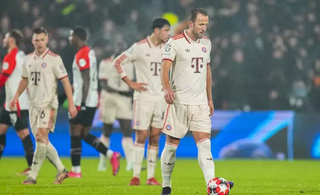 Bayern players react after Feyenoord's Ayase Ueda scoring his side's third goal during the Champions League opening phase soccer match between Feyenoord and Bayern Munich, at De Kuip Stadium, in Rotterdam, Netherlands, Wednesday, Jan. 22, 2025. (AP Photo/Peter Dejong)