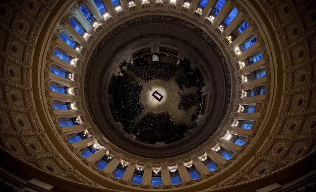 The flag-draped casket of former President Jimmy Carter lies in state at the rotunda of the U.S. Capitol Tuesday, Jan. 7, 2025, in Washington. (Andrew Harnik/Pool via AP)