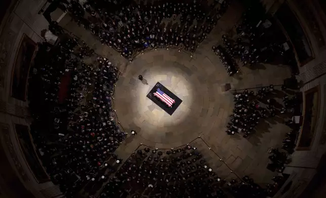 The flag-draped casket of former President Jimmy Carter lies in state at the rotunda of the U.S. Capitol Tuesday, Jan. 7, 2025, in Washington. (Andrew Harnik/Pool via AP)