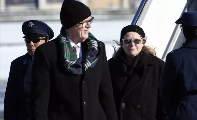 Jack Carter and Amy Carter arrive on Special Air Mission 39 before the flag-draped casket of former President Jimmy Carter is taken from the plane at Joint Base Andrews, Md., Tuesday, Jan. 7, 2025. Carter died Dec. 29, at the age of 100. (AP Photo/Susan Walsh, Pool)