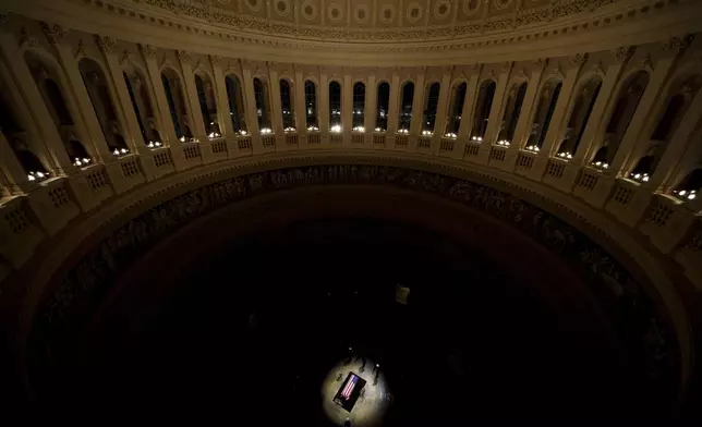 The flag-draped casket of former President Jimmy Carter as he lies in state at the rotunda of the U.S. Capitol Tuesday, Jan. 7, 2025, in Washington. (Andrew Harnik/Pool via AP)