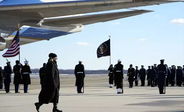 Amy Carter arrives on Special Air Mission 39 before the flag-draped casket of former President Jimmy Carter is taken from the plane at Joint Base Andrews, Md., Tuesday, Jan. 7, 2025. Carter died Dec. 29, at the age of 100. (AP Photo/Susan Walsh, Pool)