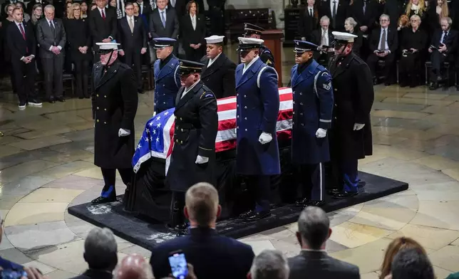 The flag-draped casket of former President Jimmy Carter arrives to lie in state at the rotunda of the U.S. Capitol Tuesday, Jan. 7, 2025, in Washington. Carter died Dec. 29 at the age of 100. (Kent Nishimura/The New York Times via AP, Pool)