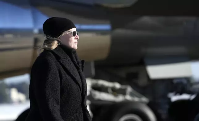 Amy Carter arrives on Special Air Mission 39 before the flag-draped casket of former President Jimmy Carter is taken from the plane at Joint Base Andrews, Md., Tuesday, Jan. 7, 2025. Carter died Dec. 29, at the age of 100. (AP Photo/Susan Walsh, Pool)