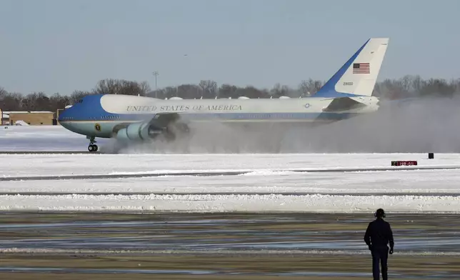 A military aircraft carrying the casket of former President Jimmy Carter, touches down at Joint Base Andrews, Md., Tuesday, Jan. 7, 2025. (AP Photo/Steve Helber)