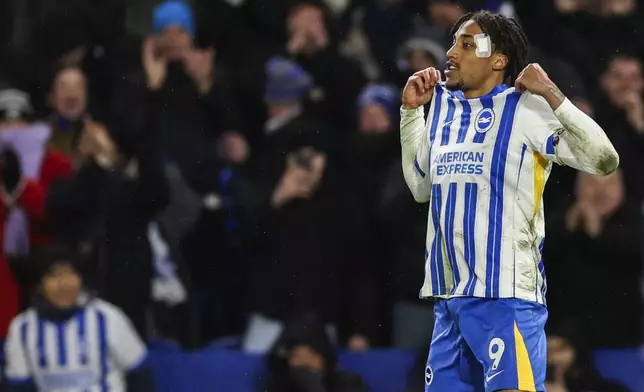 Brighton's Joao Pedro celebrates after scoring a penalty kick during the English Premier League soccer match between Brighton and Hove Albion FC and Arsenal at the Amex stadium in Brighton, Saturday, Jan. 4, 2025. (AP Photo/Ian Walton)