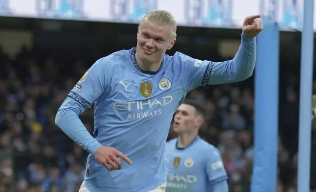 Manchester City's Erling Haaland celebrates after scoring his side's 2nd goal against West Ham during a English Premier League soccer match at Etihad stadium in Manchester, England, Saturday, Jan. 4, 2025. (AP Photo/Ian Hodgson)