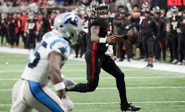 Atlanta Falcons quarterback Michael Penix Jr. runs for a touchdown against the Carolina Panthers during the first half of an NFL football game, Sunday, Jan. 5, 2025, in Atlanta. (AP Photo/Mike Stewart)