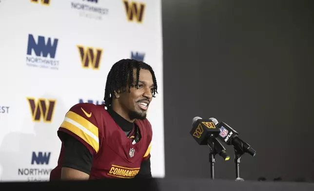 Washington Commanders quarterback Jayden Daniels (5) talks to reporters after an NFL football game against the Atlanta Falcons, Sunday, Dec. 29, 2024, in Landover, Md. The Commanders won in overtime 30-24. (AP Photo/Nick Wass)