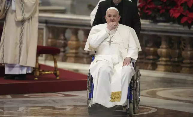 Pope Francis leaves at the end of a mass in St. Peter's Basilica at The Vatican on New Year's Day, Wednesday, Jan. 1, 2025. (AP Photo/Andrew Medichini)