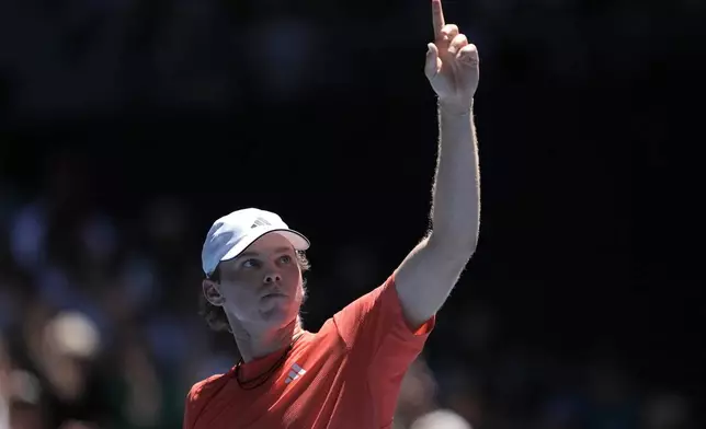 Alex Michelsen of the U.S. gestures during his third round match against Karen Khachanov of Russia at the Australian Open tennis championship in Melbourne, Australia, Saturday, Jan. 18, 2025. (AP Photo/Ng Han Guan)
