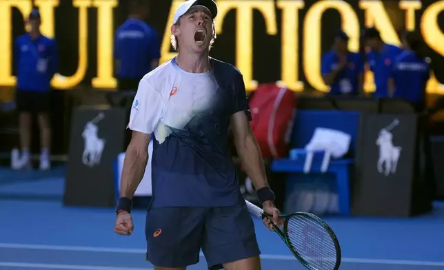 Alex de Minaur of Australia celebrates after defeating Francisco Cerundolo of Argentina in their third round match at the Australian Open tennis championship in Melbourne, Australia, Saturday, Jan. 18, 2025. (AP Photo/Asanka Brendon Ratnayake)