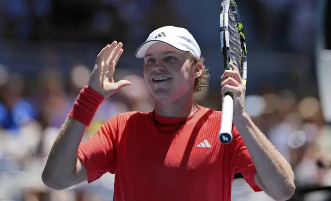 Alex Michelsen of the U.S. reacts after defeating Karen Khachanov of Russia in their third round match at the Australian Open tennis championship in Melbourne, Australia, Saturday, Jan. 18, 2025. (AP Photo/Ng Han Guan)