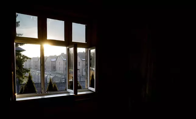 A view onto the Auschwitz-Birkenau State Museum can be seen from the former house of Auschwitz commandant Rudolf Höss, in Oswiecim, Poland, on Sunday Jan. 26, 2025. (AP Photo/Czarek Sokolowski)
