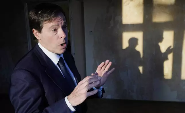 Mark Wallace, the CEO of the Counter Extremism Project, speaks to reporters in the former home of Auschwitz commandant Rudolf Höss, which is being transformed into the Auschwitz Center on Hate, Extremism and Radicalization, in Oswiecim, Poland, on Sunday Jan. 26, 2025. (AP Photo/Czarek Sokolowski)