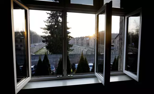 A view onto the Auschwitz-Birkenau State Museum can be seen from the former house of Auschwitz commandant Rudolf Höss, in Oswiecim, Poland, on Sunday Jan. 26, 2025. (AP Photo/Czarek Sokolowski)